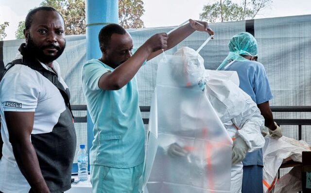 WHO chief urges safe burials in visit to heart of Ebola outbreak