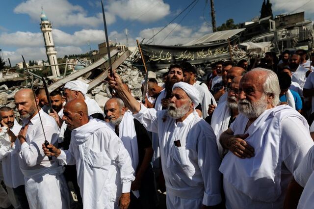 Shi'ite Muslims mark their holiest day in war-battered Lebanon
