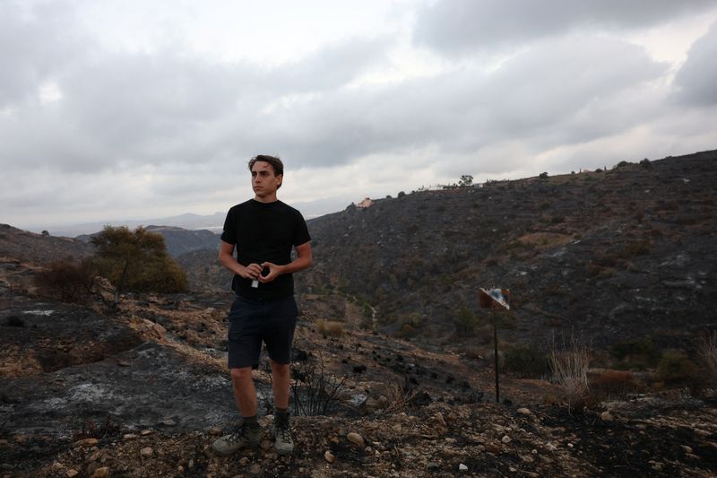 Thomas-Wolf Verdonckt looks over the burnt landscape near Bédar.